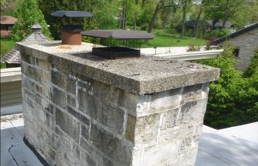 Chimney with two chimney caps installed on top