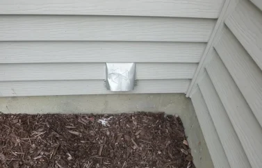 External dryer vent located on home siding.